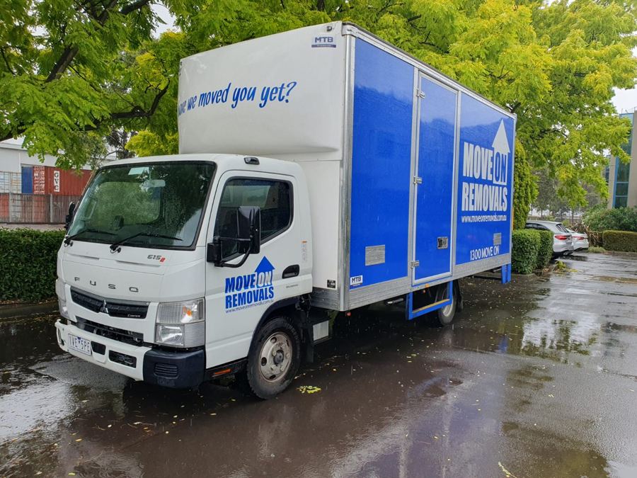 Move On Removals Fuso removal truck parked on a suburban street