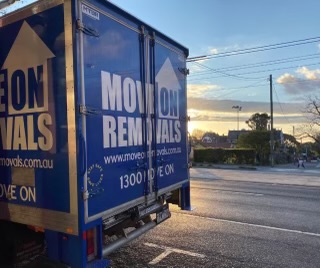 Move On Removals truck on a Melbourne street at dusk