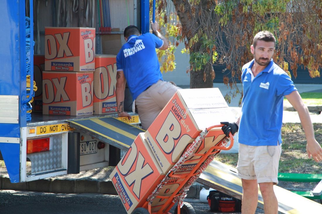 Move On Removals crew loading boxes into truck