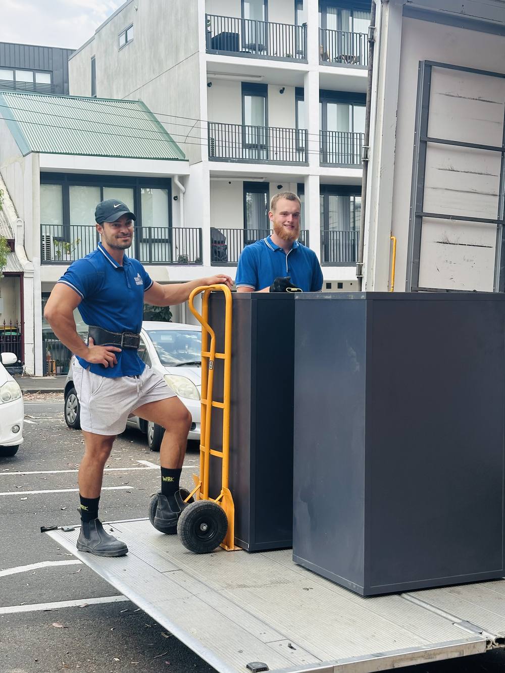 Move On Removals crew loading a filing cabinet onto the truck