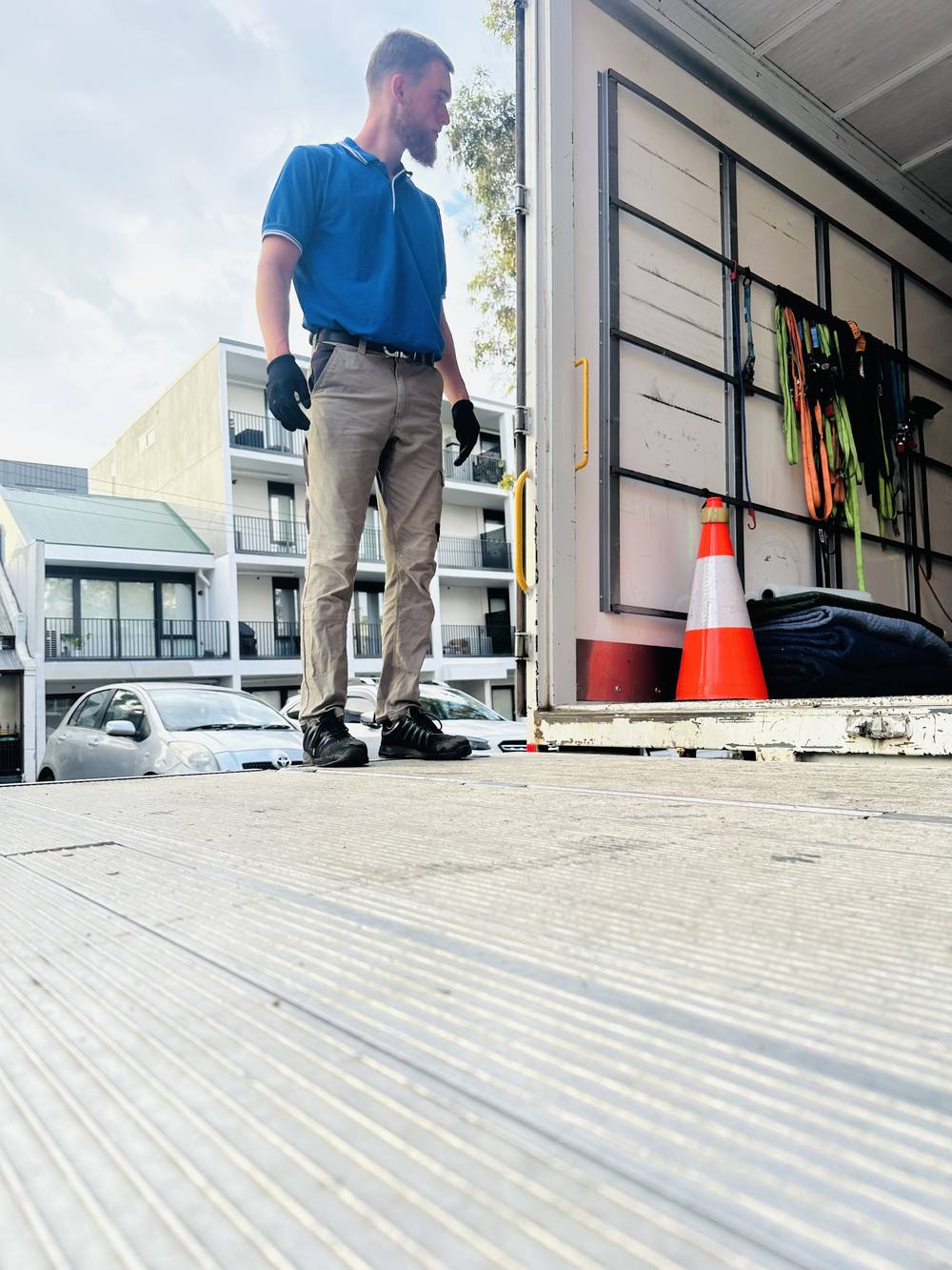 Mover checking the truck ramp before loading
