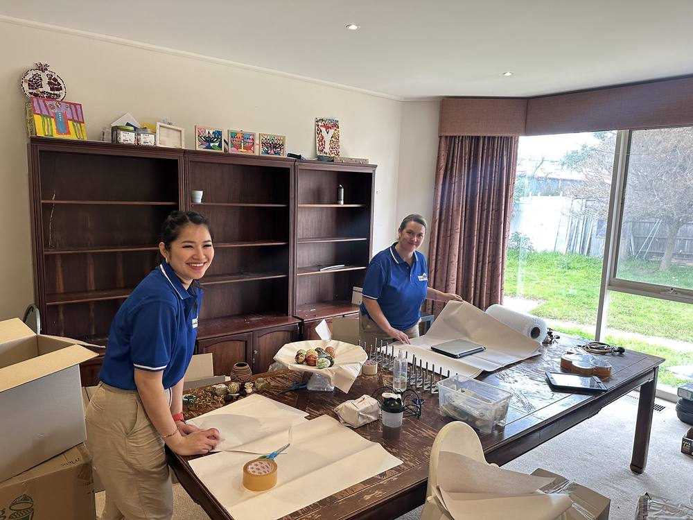 Move On Removals team wrapping fragile items at a client's home