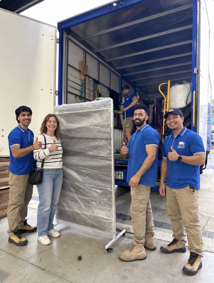 Move On Removals crew with a happy customer beside a loaded removal truck in Melbourne